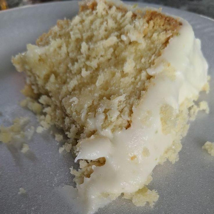 a piece of cake sitting on top of a white plate with crumbs all over it