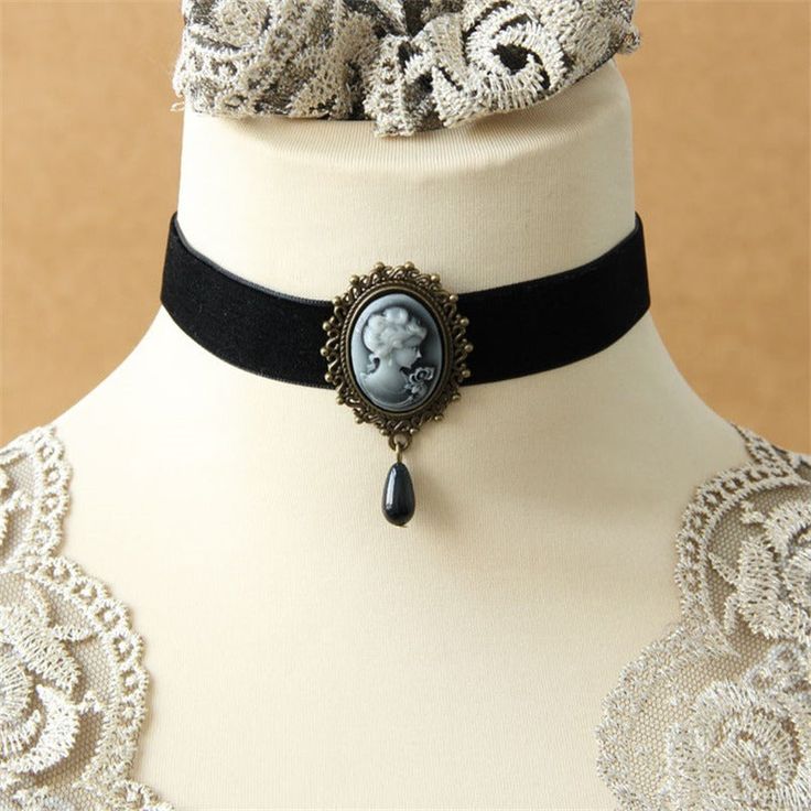 Our Victorian Choker : Timeless Elegance Have you ever dreamed of wearing a jewelry piece that celebrates your femininity while staying true to a timeless style? The Victorian Choker necklace is the answer to your dreams. Don't wait any longer to add this steampunk choker necklace to your jewelry collection. Order today and enjoy fast and free shipping as well as a 100% satisfaction guarantee! More about the choker: Total length 14 inches |36 cm Style: Neo-Gothic Material: velvet, zinc alloy Loo Victorian Choker Necklace, Cameo Choker, Steampunk Choker, Victorian Choker, Victorian Style Jewelry, Black Cameo, Victorian Accessories, Vintage Choker Necklace, Velvet Choker Necklaces