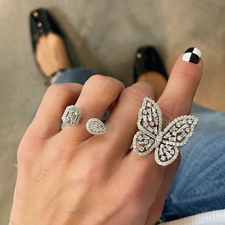 This stunning butterfly statement ring is covered in just the right amount of round and baguette diamonds. The stones are set meticulously in all the right places to complement the design. Available in 18k yellow, rose, or white gold 2.87ctw round diamonds 1.02ctw baguette diamonds 12g of gold Measures approximately 30mm x 20mm By Curated by AB Luxury Gold Butterfly Ring With Diamond Accents, Diamond Butterfly Ring For Wedding, Fine Jewelry Style, Luxury Gold Diamond Butterfly Ring, Luxury Gold Butterfly-shaped Ring, Butterfly Diamond Ring, Luxury Butterfly-shaped Fine Jewelry Rings, Diamond Butterfly Ring, Diamond Butterfly, Butterfly Ring