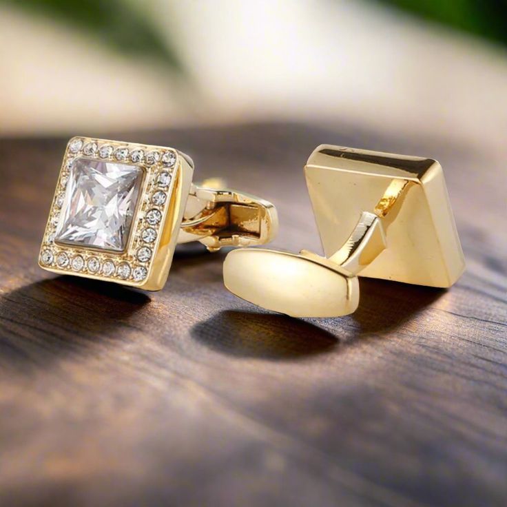 Gold Cufflinks with Clear Glass Stones These gold-colored cufflinks with clear glass stones add a touch of luxury and sophistication to any outfit. Their classic design makes them a versatile accessory for both formal and semi-formal occasions. Dress Shirts: White Dress Shirt: Timeless and elegant, a white dress shirt pairs perfectly with the gold and clear stone cufflinks, highlighting their brilliance. Light Blue Dress Shirt: Adds a hint of color while maintaining a refined look, allowing the Classic Cuff Jewelry For Party, Classic Gold Cufflinks For Party, Elegant Silver Cufflinks For Office, Classic Rose Gold Cufflinks For Formal Occasions, Elegant Gold Cufflinks, Elegant Rose Gold Cufflinks For Business, Luxury Gold Jewelry For Office, Gold Clip-on Cufflinks For Business, Elegant Gold Cufflinks For Office