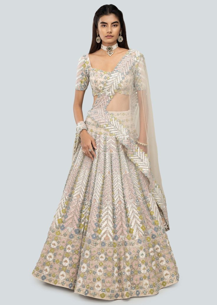 Alabaster applique and embellished heavy kali mirror work net lehenga with broad lehenga border, blouse and broad border net dupatta. Cream Dress With Sheer Dupatta For Navratri, Cream Anarkali Set With Mirror Work For Navratri, Cream Floor-length Lehenga For Festivals, Beige Dupatta For Reception At Navratri, Festival Cream Floor-length Lehenga, Cream Dupatta With Mirror Work For Navratri, Cream Mirror Work Dupatta For Navratri, Designer Wear Beige Floor-length Lehenga, Designer Beige Floor-length Lehenga