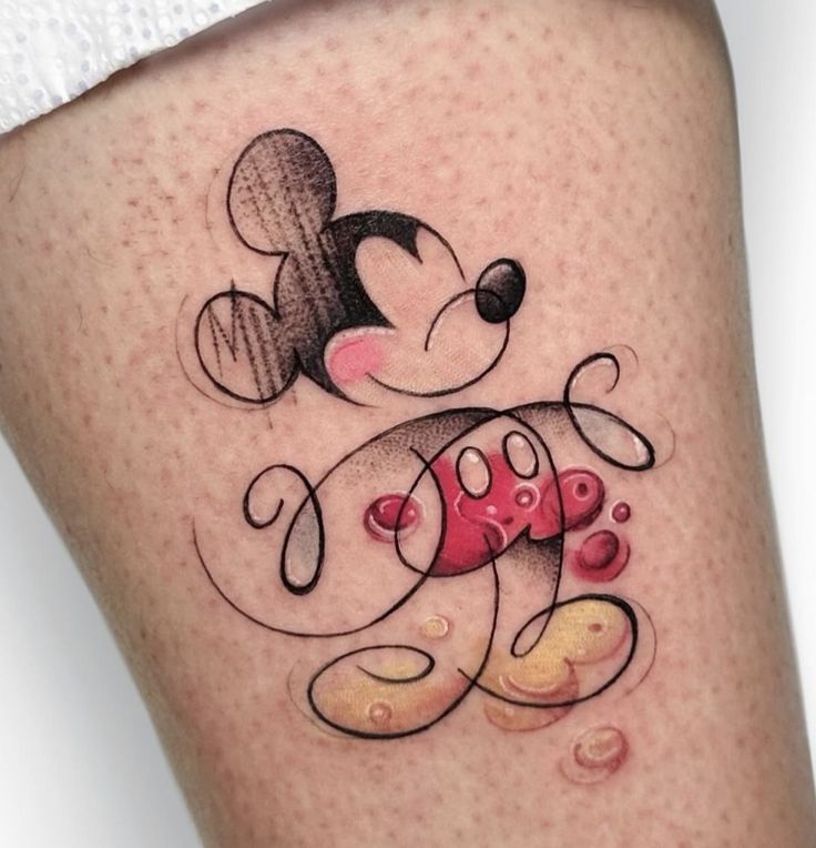 a tattoo with a mickey mouse on it