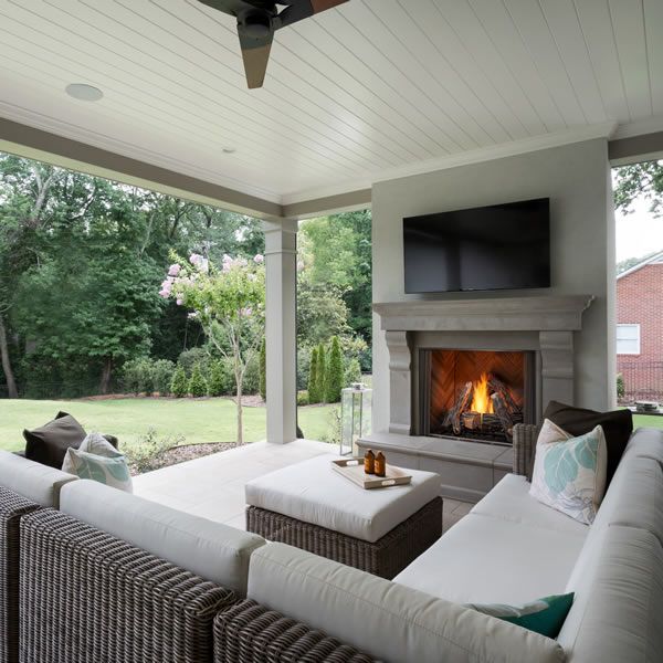 a living room filled with furniture and a fire place