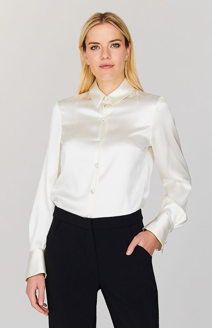 Our signature collared button down shirt is an elegant update to a wardrobe staple. Cut with a beautifully drapey and relaxed sleeve and finished with a wide angled cuff that can be worn long or folded up for maximum versatility. An easy way to add a pop of color and shine under a jacket, but strong enough to stand alone. Elegant Fitted Blouse With Button Closure, Chic Collared Dress Shirt For Work, Chic Dress Shirt With Button Cuffs And Spread Collar, Chic Dress Shirt With Spread Collar And Button Cuffs, Elegant Dress Shirt With Button Cuffs And Spread Collar, Elegant Tailored Shirt With Concealed Placket, Modern Collared Formal Blouse, Elegant Shirt With Covered Buttons For Fall, Classic Long Sleeve Blouse With Cuffed Sleeves