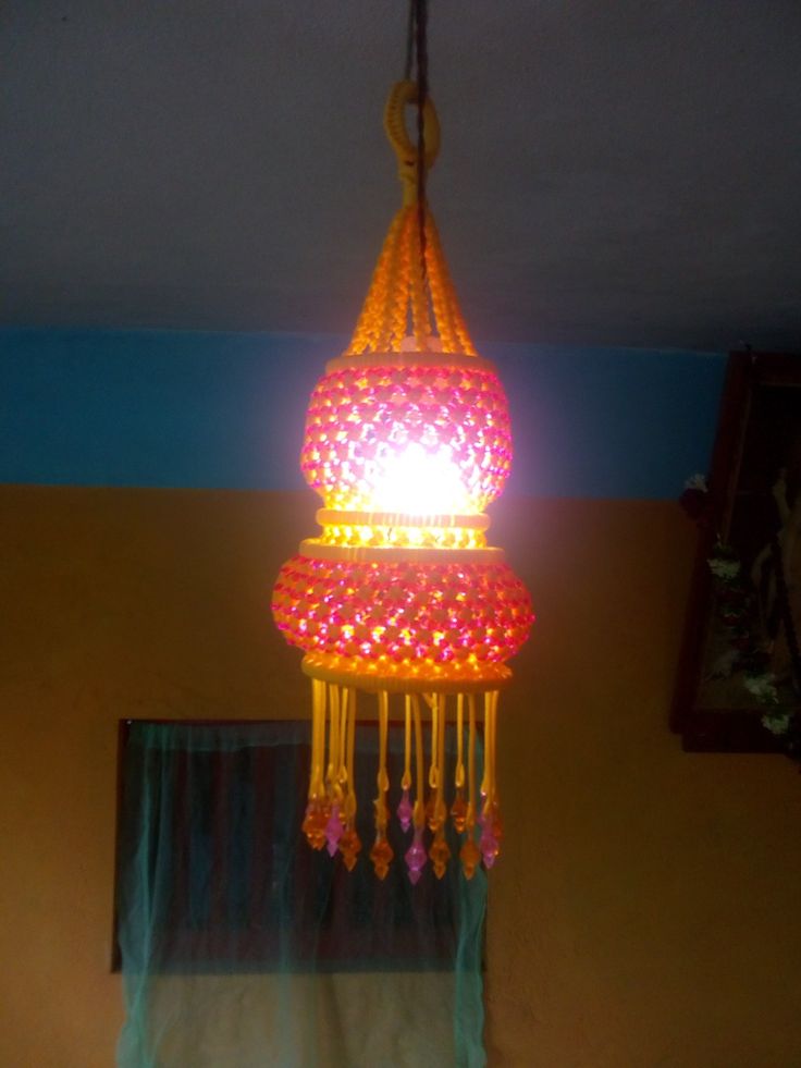 a lamp hanging from the ceiling in a room