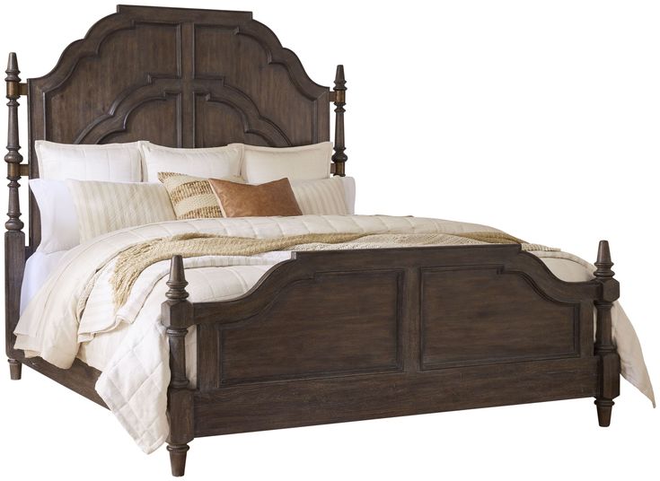 a bed with wooden headboard and foot board, made in dark brown stain wood