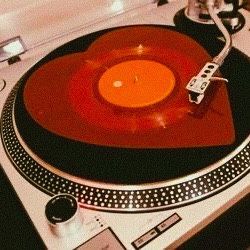 a turntable with an orange disc on it