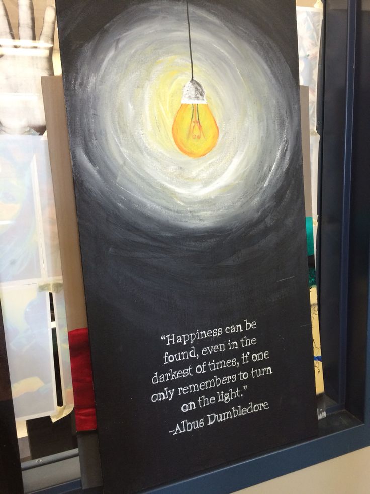 a painting with a light bulb hanging from it's side