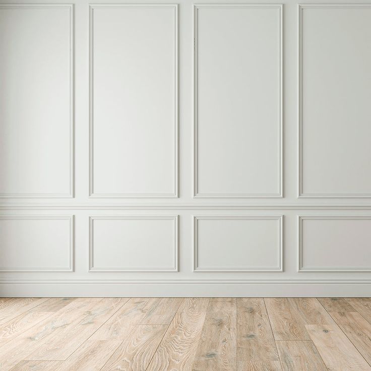 an empty room with white walls and wood flooring is shown in this image, there is