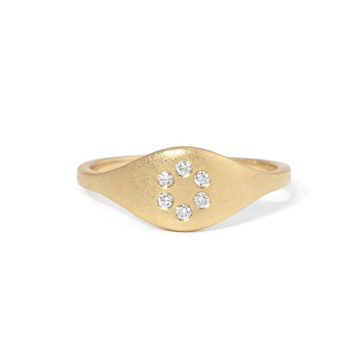 The true beauty of this ring lies in its discreet yet elegant circle of diamonds. Subtly nestled within the design, these diamonds add a touch of understated glamour, elevating your look without overwhelming it. Details: White diamonds .09tcw 14k gold Ready to ship - size 7 All other sizes are made-to-order and can take up to three weeks to ship Fine Jewelry Diamond Initial Ring With Round Cut, Modern Diamond Initial Ring For Promise, Fine Jewelry Initial Ring With Diamond Accents, Classic Diamond Initial Promise Ring, White Gold Diamond Initial Ring With Round Band, Classic White Gold Initial Ring With Diamond Accents, Oval Diamond Stackable Rings With Diamond Accents, Diamond Pave Setting Timeless Signet Ring, Timeless Diamond Signet Ring With Pave Setting