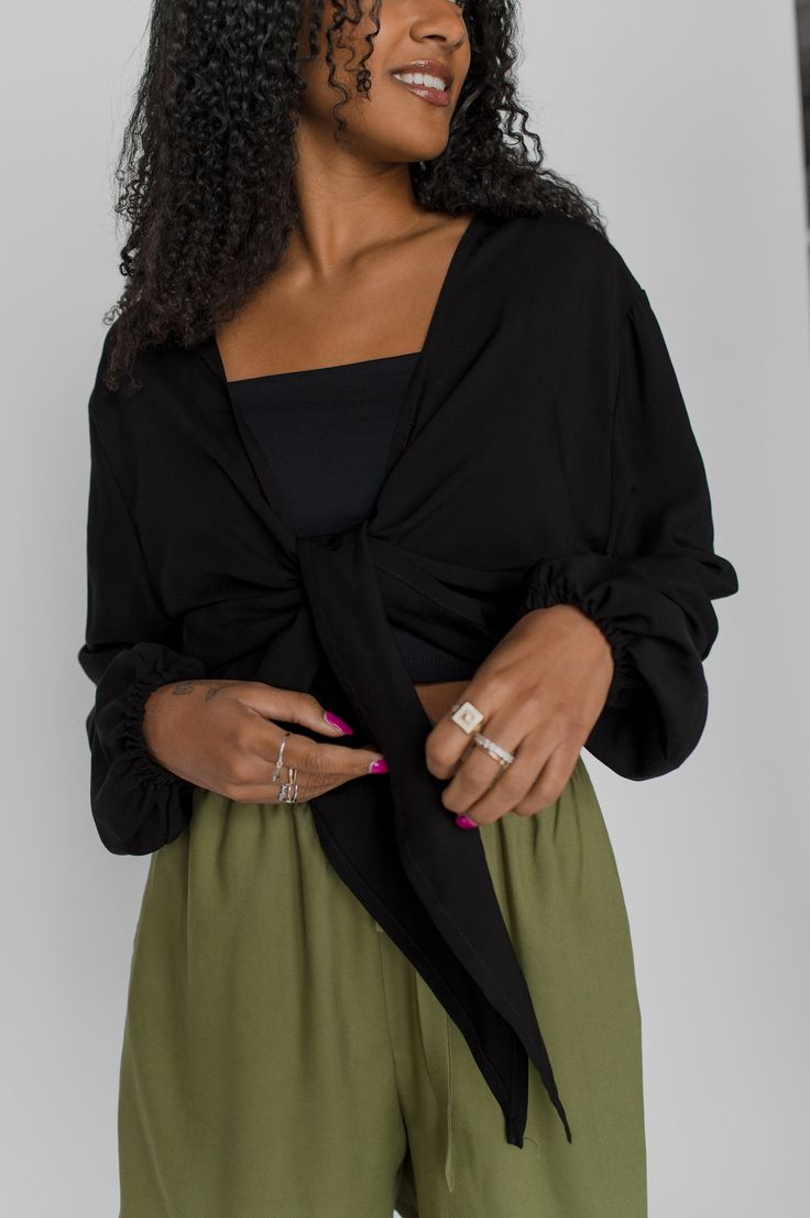 Our most versatile top. Practical and comfortable as we like. It can be tied in many ways, worn alone or layered. We love it to travel, to go out or just to feel beautiful.Made of a soft and non-stretch twill (100% viscose) fabric. It has elastics at the bottom of the sleeves to create a balloon sleeves effect. There are 2 points at the front that allow to tie it. Made in Quebec, Canada. For the modern & smart woman. Cut & size- Loose fit- Long & puffy sleeves- Hip length- Perfect match with our Smart Woman, Smart Women, Black Canary, Canary Yellow, Quebec Canada, Feel Beautiful, Donate To Charity, Unisex Accessories, Puffy Sleeves