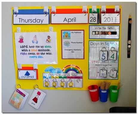 a bulletin board with calendars on it and other things to do in the classroom