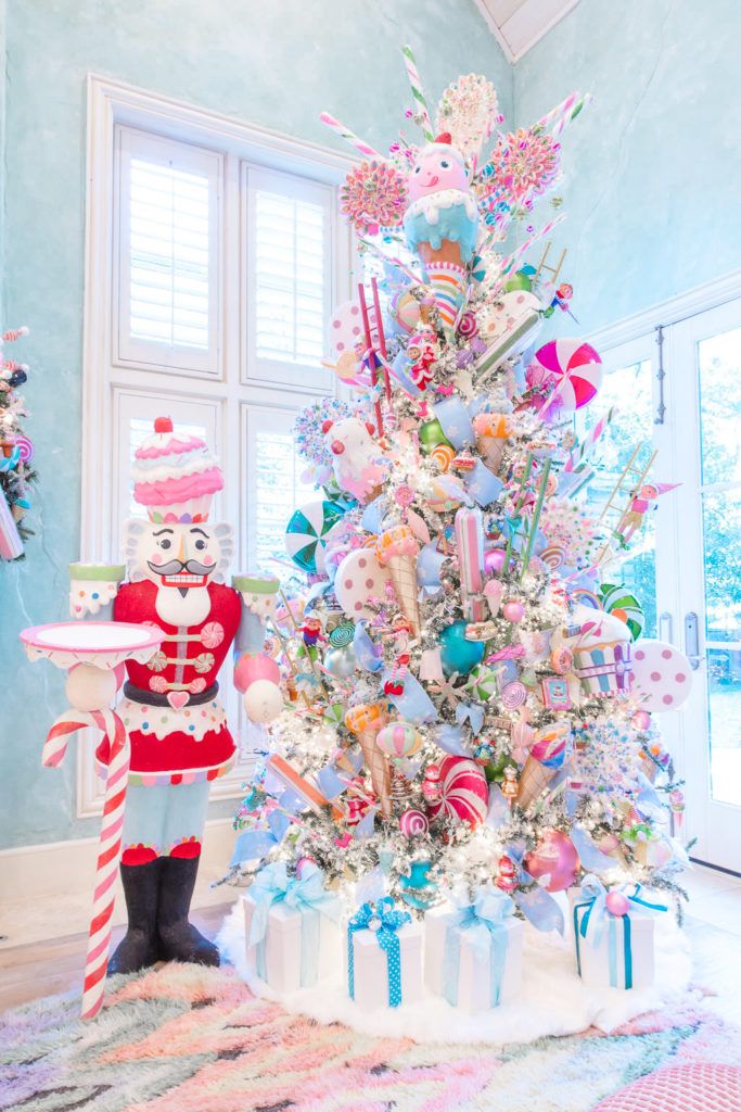 a christmas tree decorated with candy canes and candies