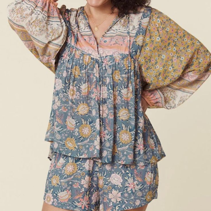 New With Tags, Spell Mossy Boho Blouse In Evening Size Xs. The Spell Mossy Blouse Is The Newest Take On A Classic Spell Blouse Fit. Featuring A Hand Drawn Mossy Ditsy Print With Florals That Dance In Hues Of Pink, Blue And Gold. Fits True To Size, It's Unlined And Crafted In An Uber Light And Floaty Blend Of 50/50 Lenzing Eco Vero Viscose And Organic Cotton. It Features A Bow That Can Be Left Loose Or Tied For A More Elevated Look. Lovely Pleats Adorn The Neckline And The Center Back Adding Some Bohemian Floral Print Tops For Loungewear, Bohemian Viscose Tops For Daywear, Flowy Blouse For Spring Loungewear, Spring Bohemian Blouse For Loungewear, Multicolor Blouse For Spring Loungewear, Blue Bohemian Tops For Loungewear, Bohemian Blue Tops For Loungewear, Bohemian Blue Top For Loungewear, Blue Spring Loungewear Blouse