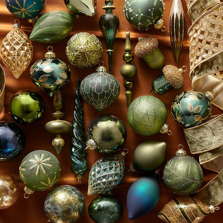 many different colored ornaments are arranged on a table