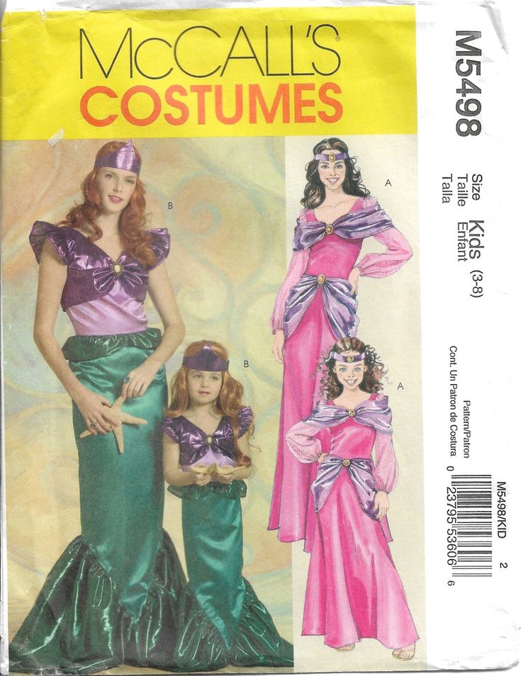 two women in long dresses and one is wearing a purple dress with ruffles