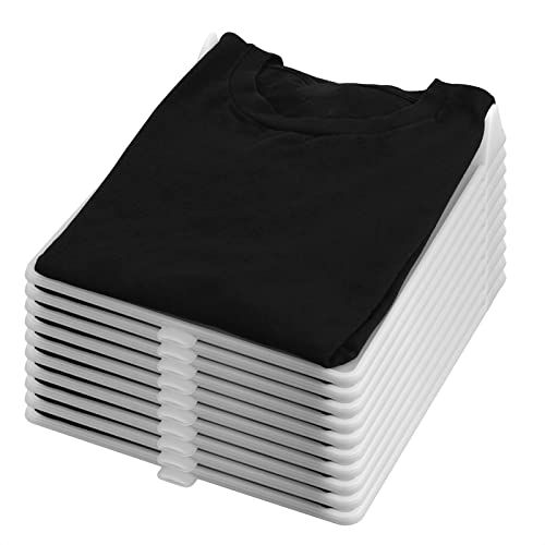 a stack of black and white t - shirts sitting on top of eachother