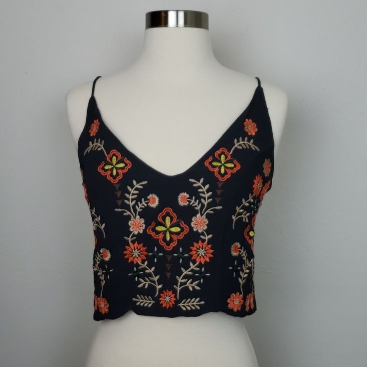 Skylar & Jade Boho Embroidered Flower Crop Top. 100% Polyester. Back Brushed Gold Zipper. Color: Tar Bust Measured Straight Across 18.5" Length: 16.5" Bag #M Summer Beach Embroidered Crop Top, Sleeveless Floral Embroidered Crop Top For Beach, Sleeveless Crop Top With Floral Embroidery For Beach, Orange Embroidered Tops For Summer, Fitted Embroidered Crop Top For Beach, Orange Embroidered Beach Top, Orange Embroidered Top For Beach, Fitted Embroidered Orange Tops, Fitted Orange Top With Floral Embroidery