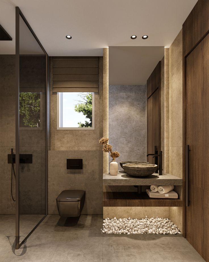 a bathroom with a sink, toilet and shower stall in it's own area