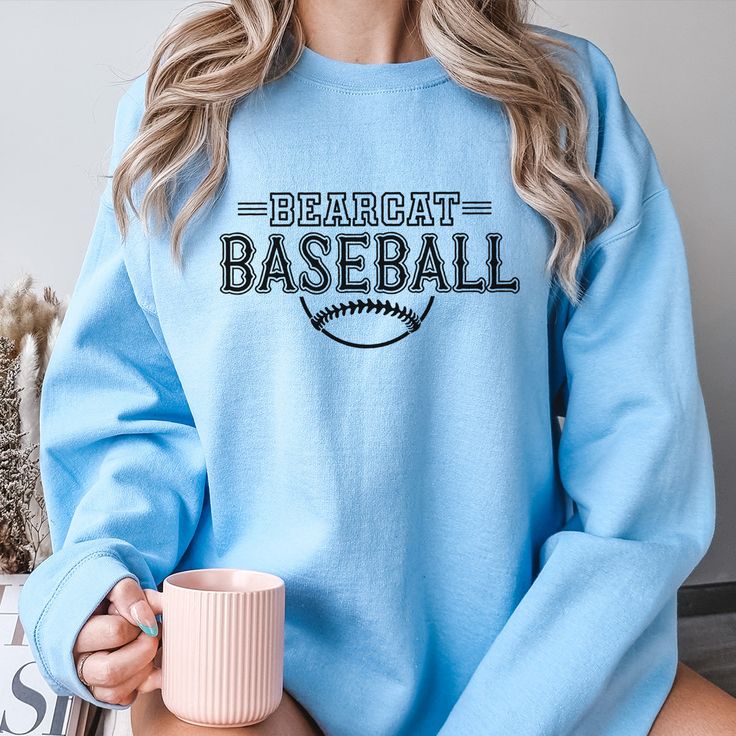 Gear up for success on and off the field with our Custom Baseball Team Sweatshirts, designed to unite your squad in style. Whether you're prepping for game day or celebrating a hard-fought victory, these sweatshirts are the ultimate symbol of team pride. Crafted from premium, ultra-soft fabric, our sweatshirts offer unbeatable comfort and durability, ensuring you stay warm and cozy during those chilly practices and post-game celebrations. But what truly sets them apart is their customizable design – you have the freedom to add your team's logo, name, or any other personalized details that represent your squad's identity. From Little League dreamers to seasoned veterans, our Custom Baseball Team Sweatshirts are perfect for players of all ages and skill levels. Whether you're huddling up in Sports Tops With Team Logo For Baseball Season, Blue Team Spirit Sweatshirt With Team Name, Sporty Tops With Ribbed Cuffs For Game Day, Baseball Season Sports Top With Team Logo, Blue Graphic Print Sweatshirt For Team Spirit, Blue Tops With Ribbed Cuffs For Sports Events, Game Day School Spirit Sweatshirt With Team Logo, School Spirit Sweatshirt With Team Logo For Game Day, Sports Season Crew Top With Team Name