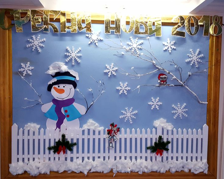 a snowman is on the fence in front of a winter scene with christmas decorations