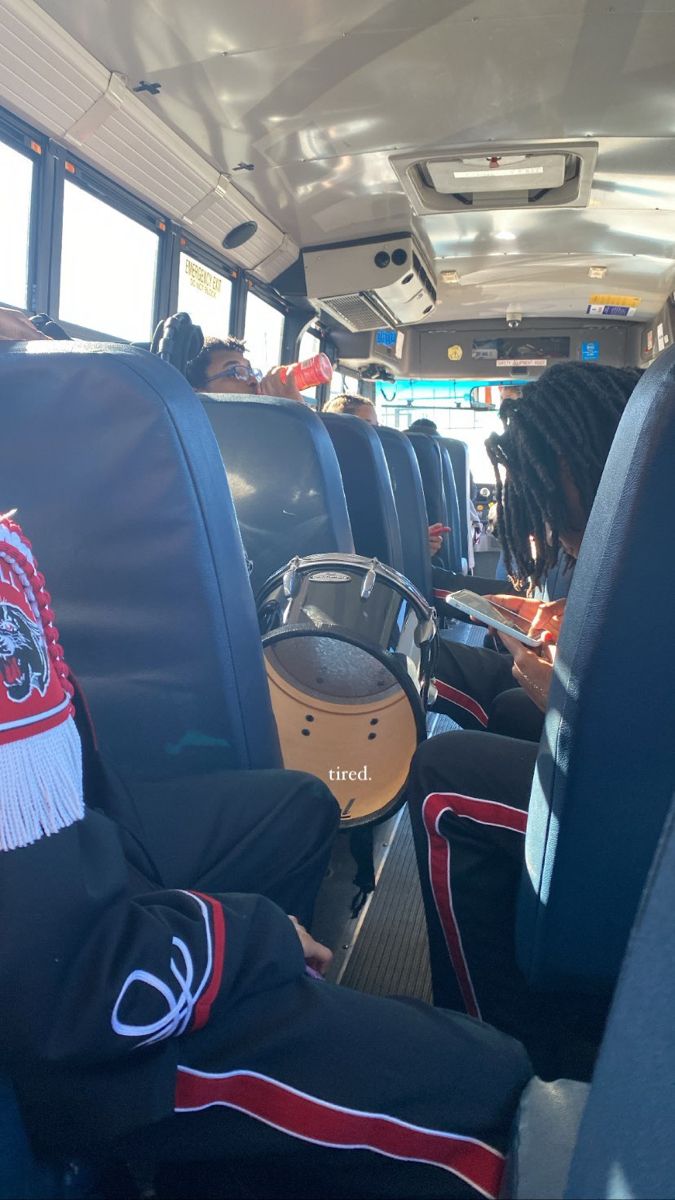 people sitting in the back of a bus