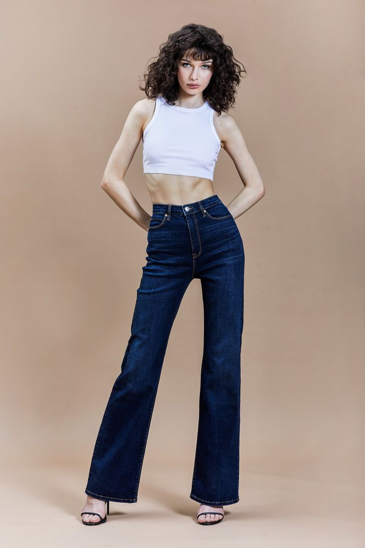 DETAILS Meet our It Girl Flare style. Hugging you in all the right places, it's perfect to pair with a boot or heel. This pair of wear-everywhere jeans has a flattering fit and '70s retro vibe. 98% Cotton/2% Spandex Machine washable Control core technology: pocket construction sculpts your midsection 5 pockets Zipper fly closure Belt loops It Girl flare Style #81437 SIZE & FIT Fitted through the hip and thigh, flared from the knee 11.25" rise (size 27) 21" leg opening (size 27) 34" inseam Model Model Photoshoot Poses, Wash Jeans Outfit, High Fashion Poses, Model Jeans, Fashion Model Poses, Denim Fashion Women, Jeans Models, High Waisted Flare Jeans, Pants Women Fashion