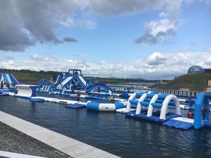 an inflatable water park on the edge of a body of water