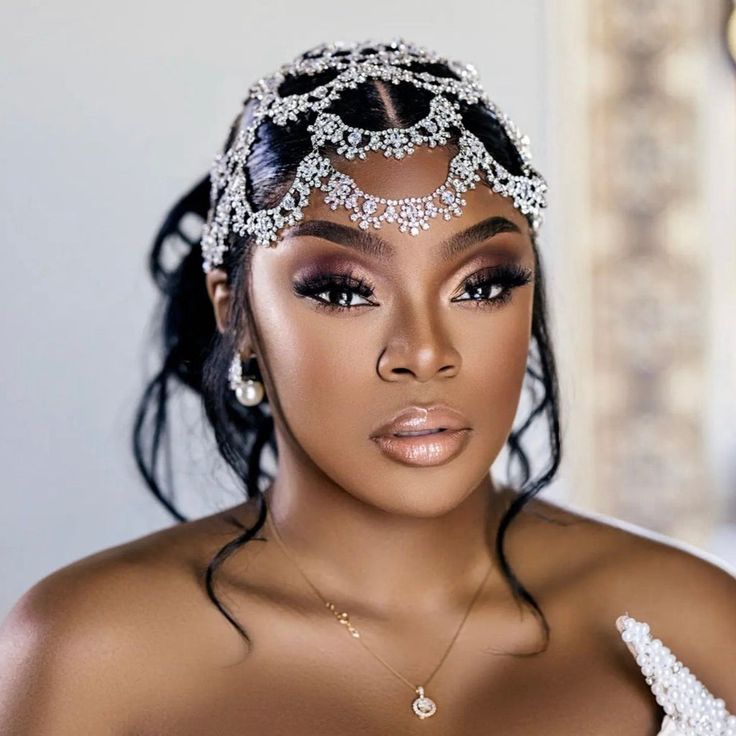 a woman wearing an elaborate headpiece and jewelry