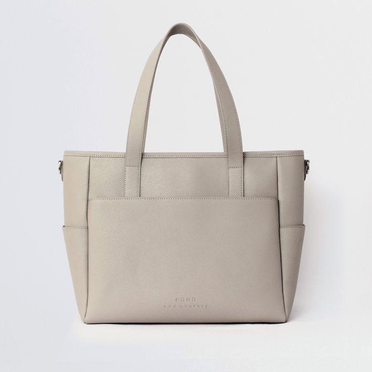 This structured tote is the ultimate do-it-all bag that you deserve. It's the perfect carryall for work, travel, and anywhere your day brings you. It features a spacious and organized interior for your essentials, a padded compartment for your laptop, side pockets for your drinks, and you can convert it into a backpack or crossbody. Crafted from premium American Saffiano leather that's waterproof and scratch-resistant, the Transform Tote will stay just as beautiful through all your travels and a Holster Purse, Concealed Carry Purse, Work Backpack, Laptop Bag For Women, Best Purses, Laptop Tote, Luggage Straps, Leather Laptop Bag, Work Bag