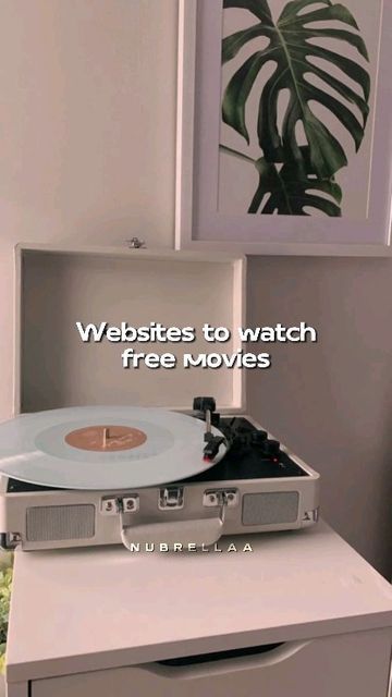 a record player sitting on top of a dresser