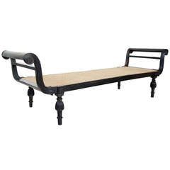 a black metal bed frame with wooden slats on it's legs and footrests