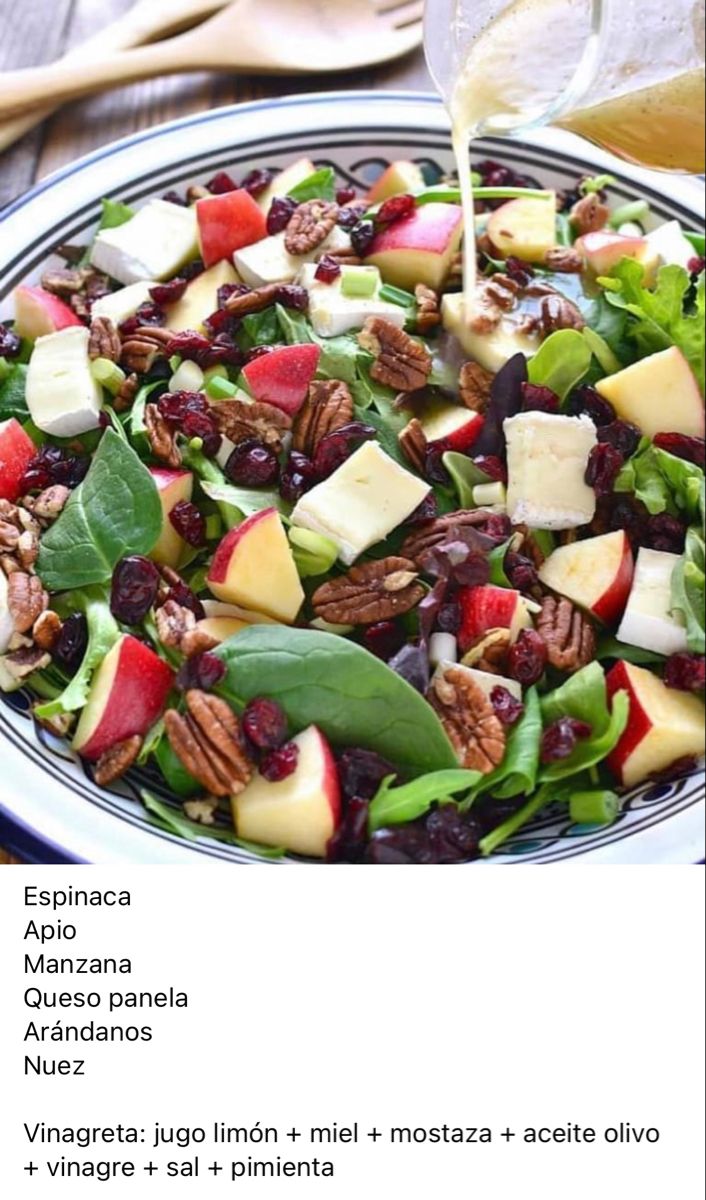 a salad with apples, cranberries and pecans