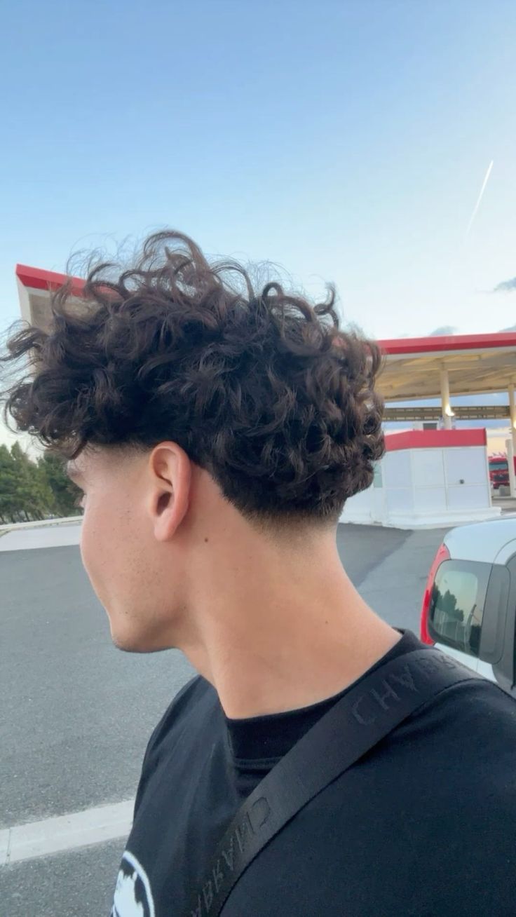 Wavy Hair Fade Men, Perm Wavy Hair Men, Taper Curly Hair Men, Loose Perm Men Long Hair, Curly Low Taper Fade, Mens Haircut Long On Top Messy, Mid Taper Curly Hair, Curly Low Taper, Curly Undercut Mens