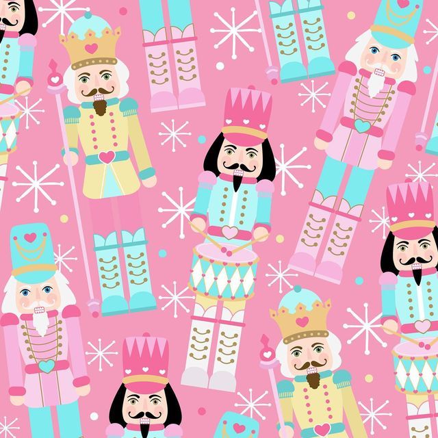 a pink pillow with nutcrackers and princesses on it