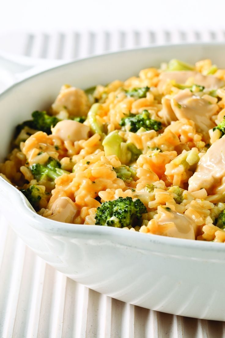 chicken and broccoli rice casserole in a white dish on a table