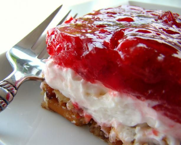 a piece of cake sitting on top of a white plate next to a knife and fork