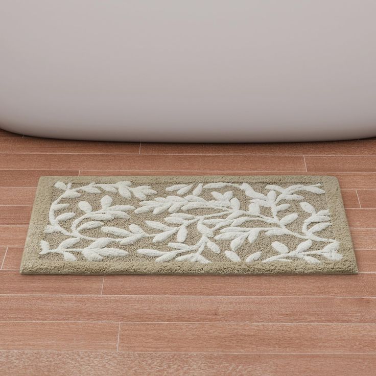 PRICES MAY VARY. High Quality Tufting - Our 100% cotton bath rug boasts superior tufted high and low construction, resulting in a stunning botanical leaf texture design. This creates an incredibly dense and plush look and feel, adding a touch of luxury to your bathroom Indulge in Luxurious Comfort: The Madison Park Serene 100% Cotton Tufted Bath Rug offers unparalleled softness and comfort to elevate your bathroom décor. With latex backing to minimize movement, it ensures both plushness and prac Bathroom Rugs Ideas Master, Bathroom Mats Decor Bath Rugs, Bathroom Mats Decor, Luxury Bath Mats, Bathroom Redesign, Leaf Texture, Cotton Bath Rug, Madison Park, Bathroom Rug