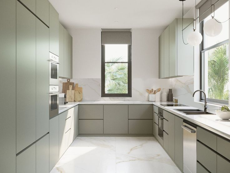 a large kitchen with marble counter tops and stainless steel appliances, along with lots of windows