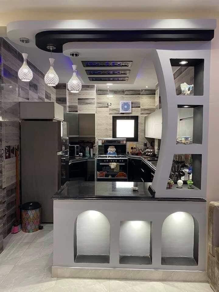 the kitchen is very modern and has an interesting design