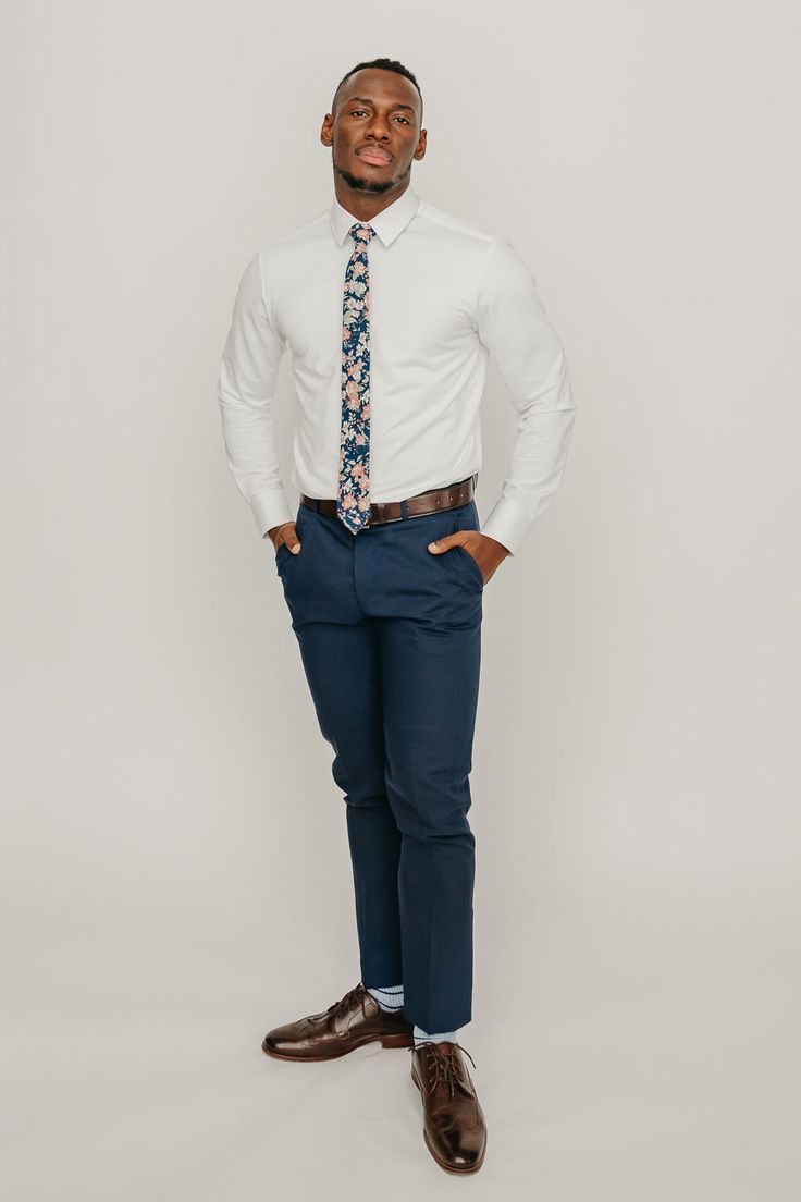 We pride ourselves in offering our customers some of the best skinny ties money can buy. Each DAZI tie is handmade from high quality imported fabrics. Features: Approx. 2.5" wide at the tip Approx. 58" in length 100% Cotton Background color: Navy. In some pictures it may appear faded black, but it is navy. Don't forget a matching pocket square! Shop our ﻿Lotus Pocket Square.