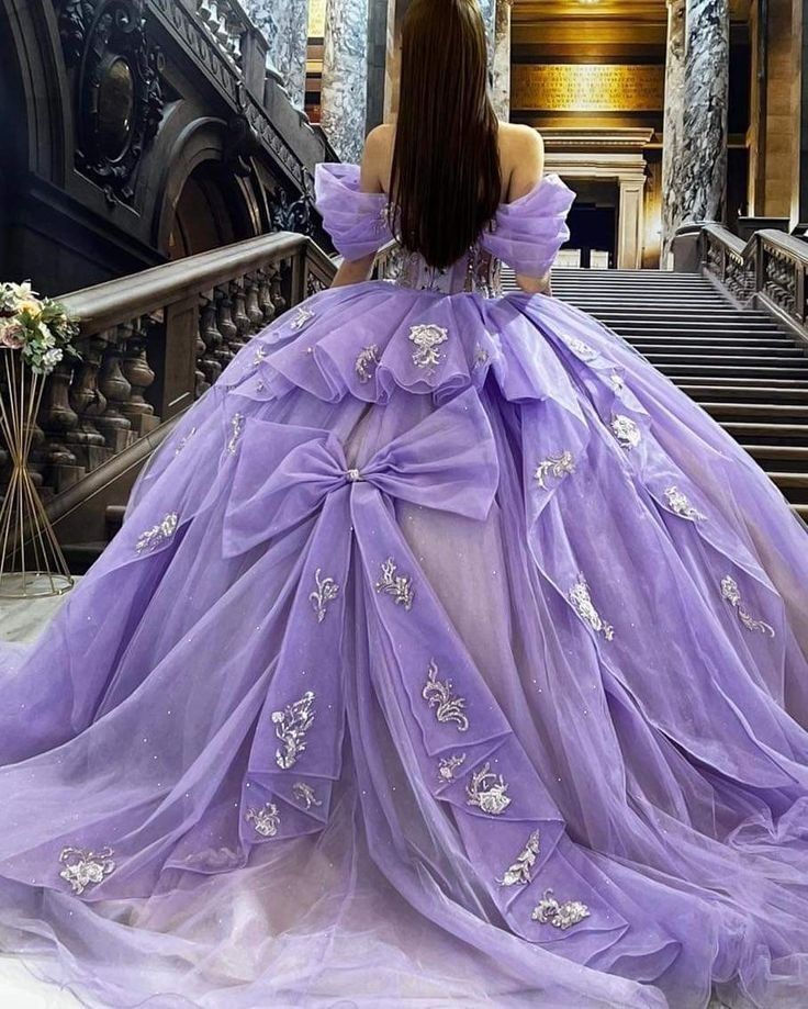 Purple Cinderella Dress, Puffy Dresses Purple, Quince Modern Dresses, Purple Tulle Ball Gown, Layered Quince Dress, Big Purple Quinceanera Dresses, Quince Dresses With Puffy Sleeves, Lavender Quinceanera Dress, Princess Ball Gowns Purple