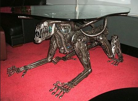 a glass table topped with a metal lizard