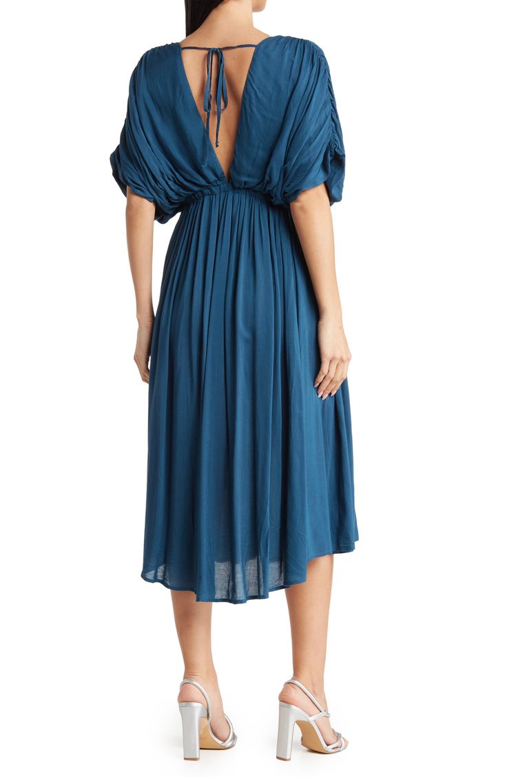 Slip into style with this puffed sleeve midi dress that exudes effortless attitude. 45" length (size S) V-neck Short puff sleeves Tied waistline 100% rayon Hand wash Imported Model stats: 5'10" height, 32" bust, 25" waist, 36" hip. Model is wearing size S. Elegant V-neck Puff Sleeve Beach Dress, Vacation V-neck Midi Dress With Gathered Sleeves, Chic Knee-length V-neck Dress With Gathered Sleeves, Casual V-neck Dress With Gathered Sleeves, Solid V-neck Midi Dress With Smocked Back, Casual V-neck Maxi Dress With Gathered Sleeves, Casual V-neck Midi Dress With Smocked Back, Spring V-neck Rayon Dress With Short Sleeves, Knee-length Midi Dress With Gathered Waist