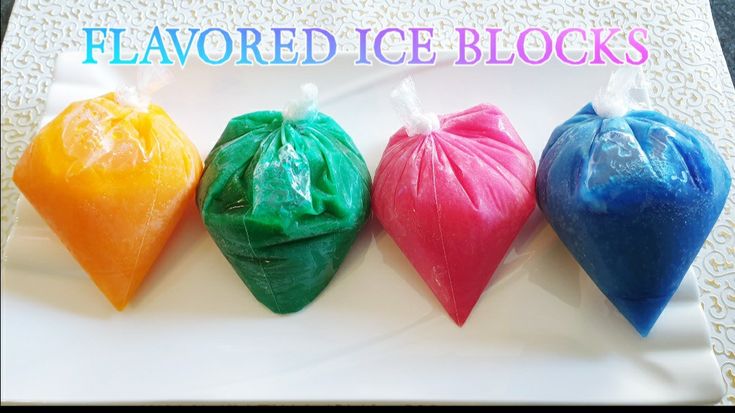 four different colored candy bags sitting on top of a white plate with the words flavored ice blocks