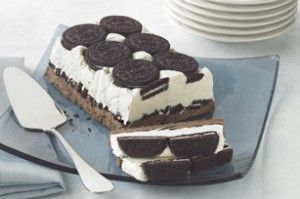 a slice of ice cream cake with oreo cookies on top