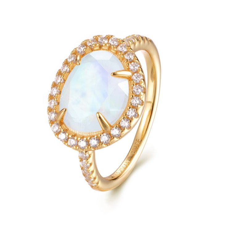 Introducing the Skye Moonstone Ring—a classic piece that features a genuine Rainbow Moonstone, beautifully framed by a halo of sparkling crystals on a pave band. Choose between luxurious 14k Gold Vermeil or elegant Sterling Silver, and let this naturally stunning gemstone captivate you with its unique charm. Each Rainbow Moonstone is handpicked for its individual beauty, ensuring that your ring is truly one-of-a-kind. Details:Gemstone: 9x11mm Genuine Rainbow MoonstoneRing Face (including crystal halo): 14mm x 11.8mmBand Width: 1.8mm Elevate your jewelry collection with the Skye Moonstone Ring—a perfect blend of elegance and enchantment. Elegant White Moon-shaped Opal Ring, Elegant Crystal Ring With Gemstone Accents, Elegant White Moon Shaped Opal Ring, Elegant Moon Shaped Diamond Rings, Fine Jewelry Moonstone Ring With Halo Setting, Gold Moon Shaped Elegant Ring, Elegant Gold Moon-shaped Ring, Elegant Gold Moon Shaped Ring, Elegant Moon Shaped Gold Rings