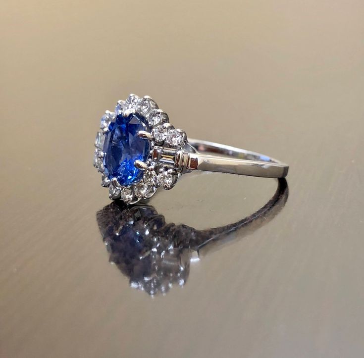 an oval shaped blue sapphire and diamond ring