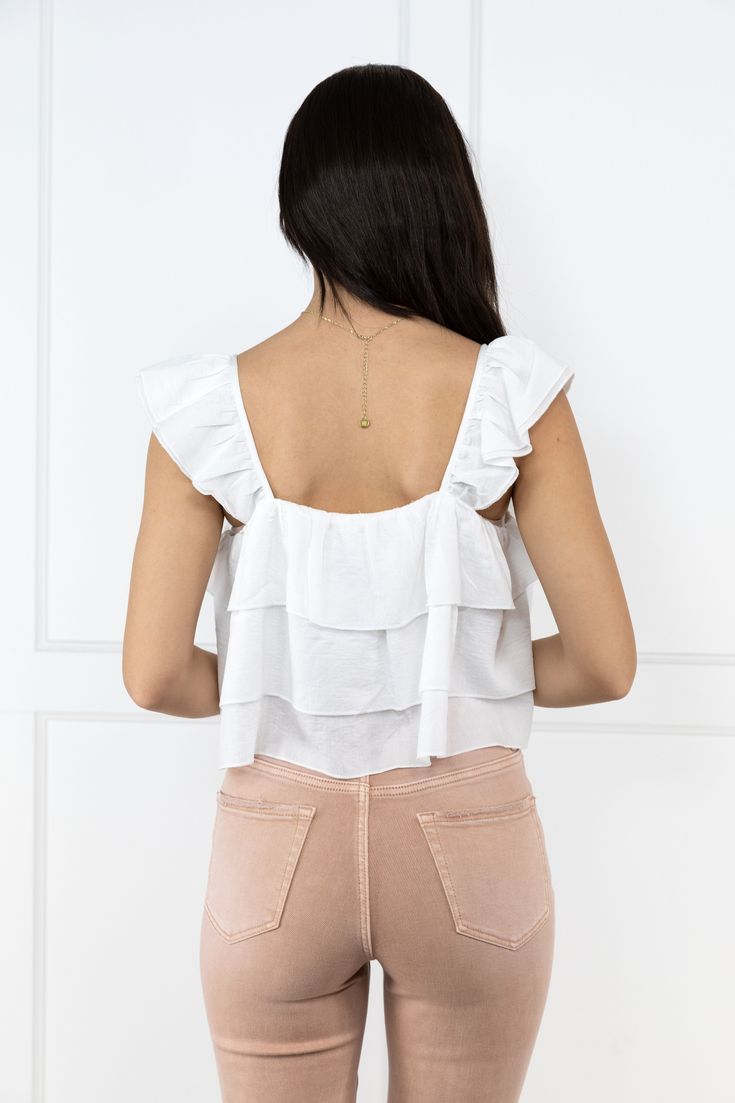 The To the Next Level Crop Top from Listicle will help you to climb to the next level in all your endeavors! This top features layered frill detail, a hi-lo hem, and a square neckline. Pair with your favorite shoes and keep climbing! Fabric: 86% Rayon, 11% Polyester, 3% Rayon Measurements: Bust (Size M): 18.5" Length (Size M): 19.5"/21.5" True To Size S 0-6 M 6-10 L 10-14 The Ladies of ALB Sizing: Model (long dark brown hair) is a size S, 33" bust, 34B bra size and is photographed in a size S! Model (medium length brown hair) is a size S, 32.5" bust, 32B bra size and is photographed in a size S! Spring Ruffled Square Neck Crop Top, Trendy Tops With Ruffle Hem And Ruffled Straps, Feminine Ruffled Crop Top With Ruffled Straps, Brunch Tops With Ruffle Hem And Ruffled Straps, Feminine Ruffled Straps Crop Top, Chic Crop Top With Ruffles, White Top With Ruffled Hem And Straps, Trendy Ruffled Square Neck Crop Top, Trendy Ruffled Tops For Layering