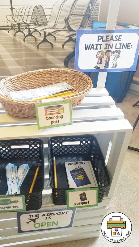 there is a basket on top of the counter with pens and pencils in it